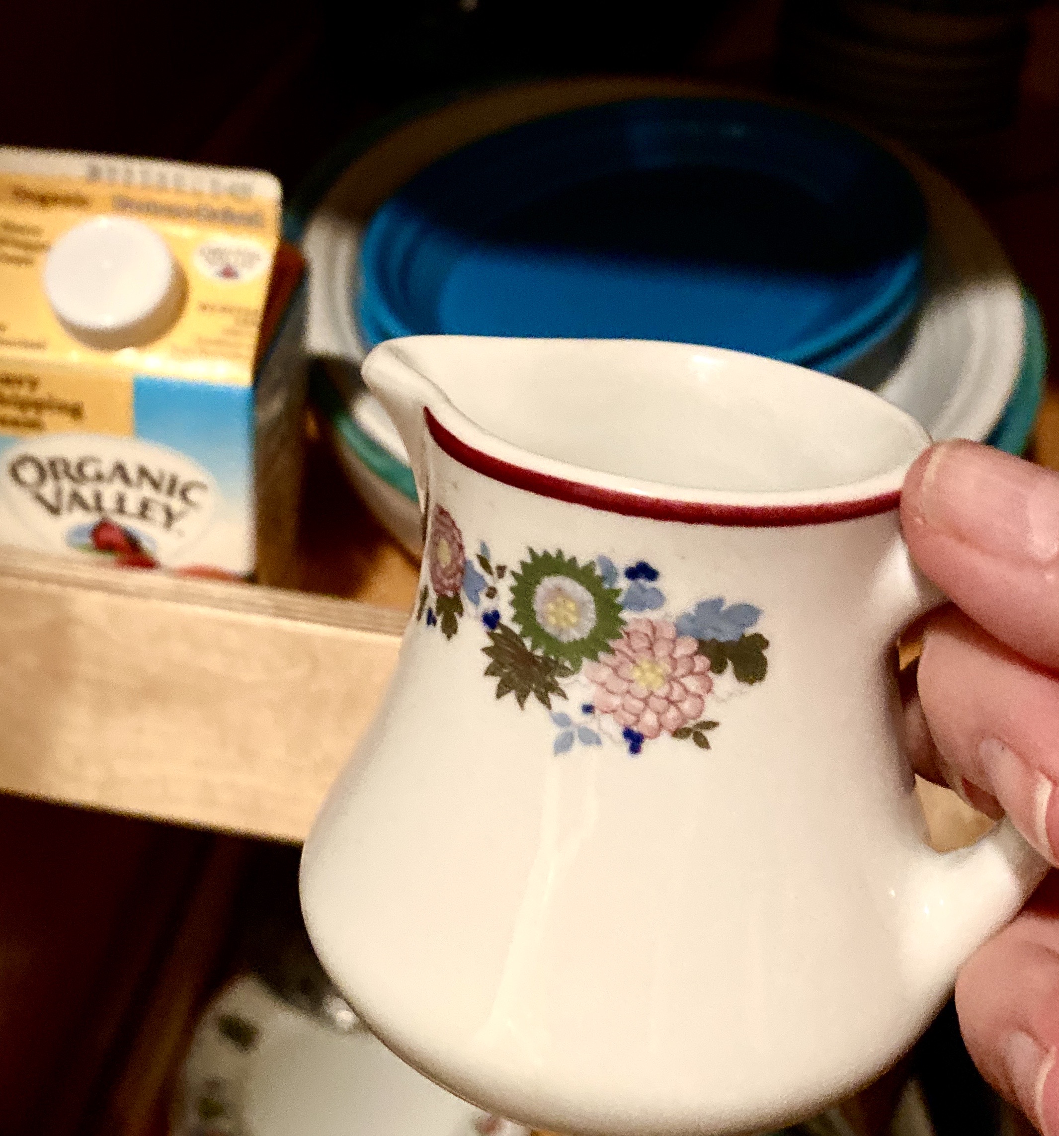 a little jug and cream on a shelf
